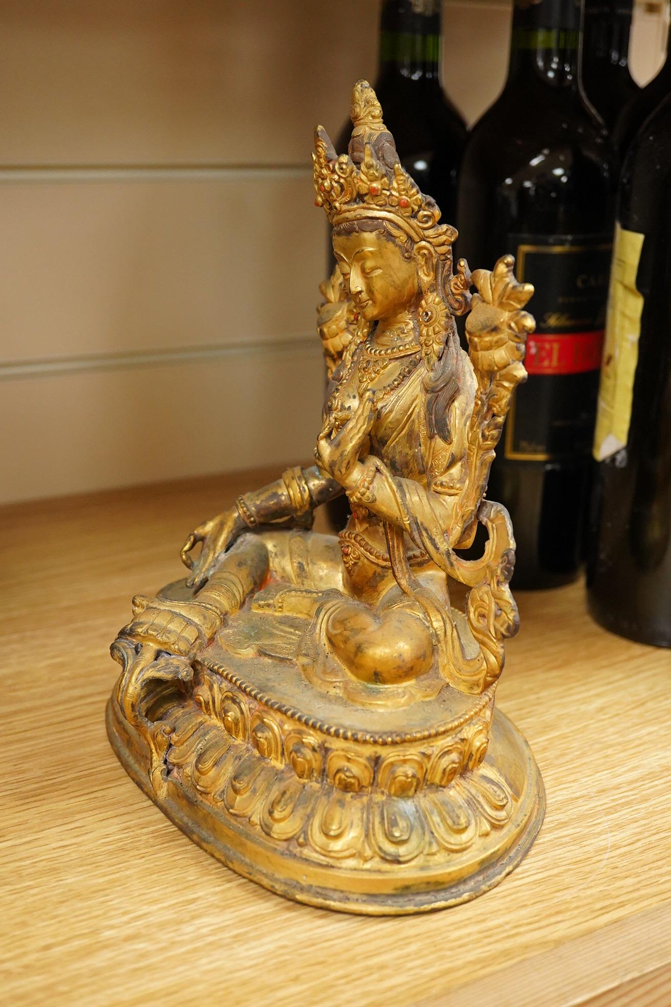 A Sino Tibetan gilt bronze figure of Green Tara, 23cm high